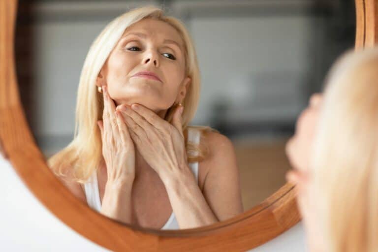 Woman looking at her reflection